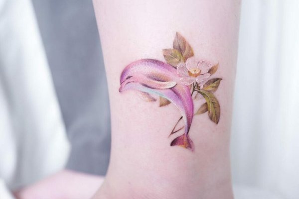 Beautiful-Dolphin-Tattoo-With-Floral-Motifs-For-Women-1024x1024