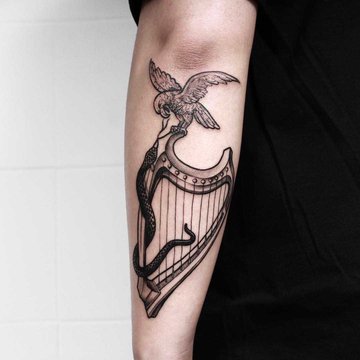 Hawk-snake-and-harp-done-at-High-Tension-Tattoo